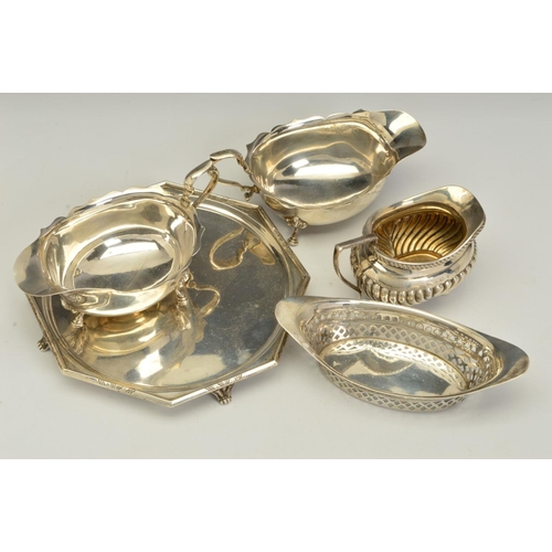 83 - A PAIR OF GEORGE V SILVER OVAL SAUCE BOATS, wavy rims, 'S' scroll handles, on cabriole legs with hoo... 