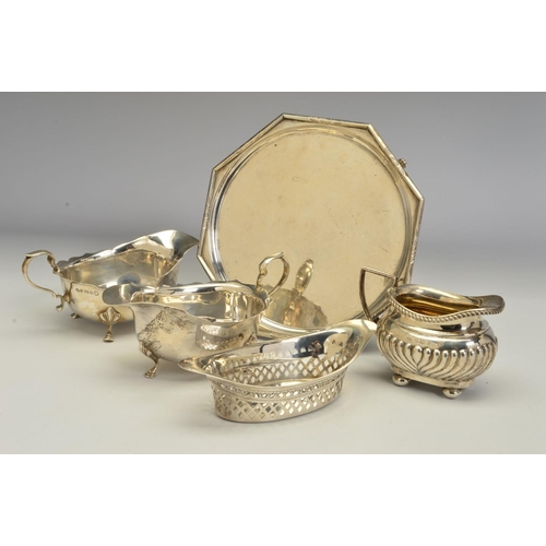 83 - A PAIR OF GEORGE V SILVER OVAL SAUCE BOATS, wavy rims, 'S' scroll handles, on cabriole legs with hoo... 