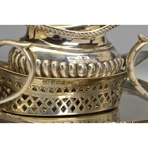 83 - A PAIR OF GEORGE V SILVER OVAL SAUCE BOATS, wavy rims, 'S' scroll handles, on cabriole legs with hoo... 