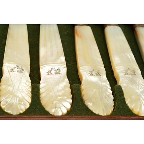 94 - A 19TH CENTURY MAHOGANY CASED SET OF MOTHER OF PEARL HANDLED CUTLERY, comprising twenty four table k... 