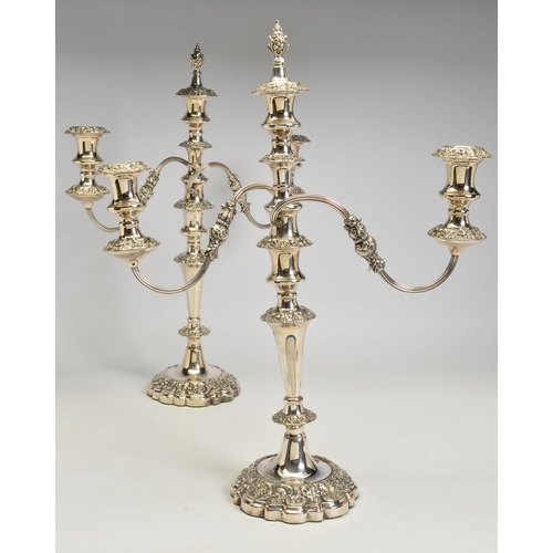 99 - A PAIR OF VICTORIAN OLD SHEFFIELD PLATE THREE BRANCH CANDELABRA, each with detachable foliate flame ... 