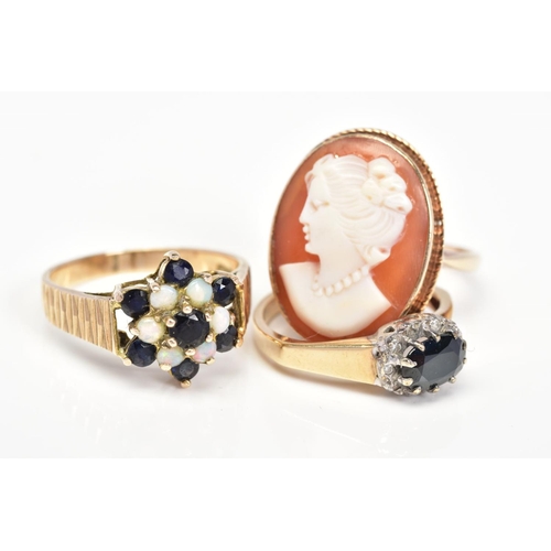100 - THREE 9CT GOLD RINGS, the first designed as an oval cameo panel depicting a lady in profile within a... 