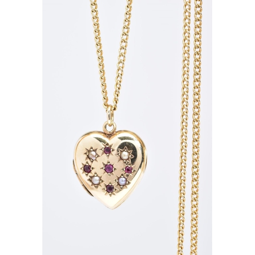 111 - A 9CT GOLD HEART LOCKET AND CHAIN, the heart locket set with red gems, assessed as rubies and split ... 