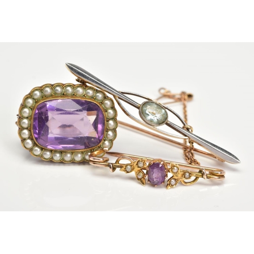 133 - THREE EARLY 20TH CENTURY BROOCHES, the first a rectangular purple paste within an imitation split pe... 