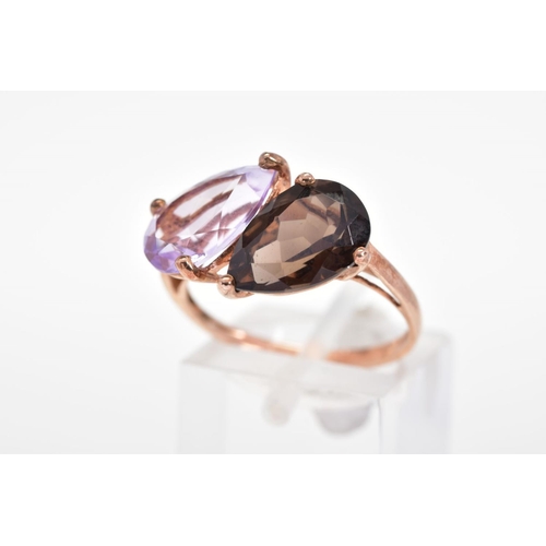 145 - A 9CT GOLD GEM SET RING, designed with a pear cut smoky quartz and amethyst to the plain polished ba... 