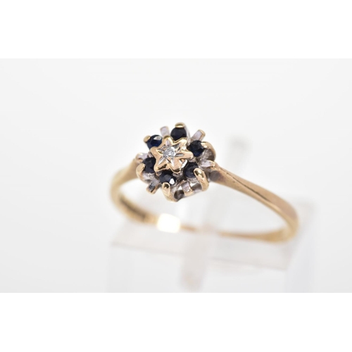 147 - A 9CT GOLD SAPPHIRE AND DIAMOND RING, of tiered design with a central single cut diamond and circula... 