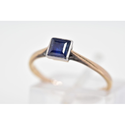 151 - A SAPPHIRE RING, designed with a central square cut sapphire in a milegrain setting to the tapered s... 