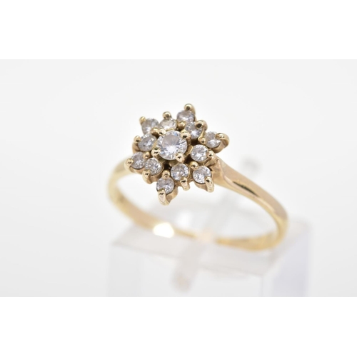 154 - A DIAMOND CLUSTER RING, the tiered cluster set with thirteen round brilliant cut diamonds, to the pl... 