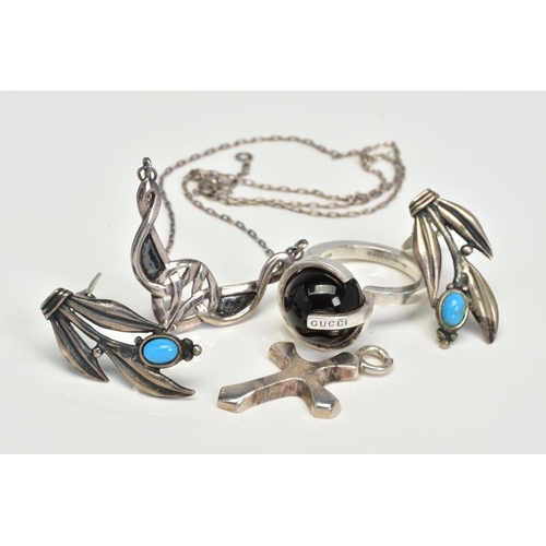 157 - FOUR ITEMS OF JEWELLERY, to include a Gucci ring designed with black sphere within a G-shape mount, ... 