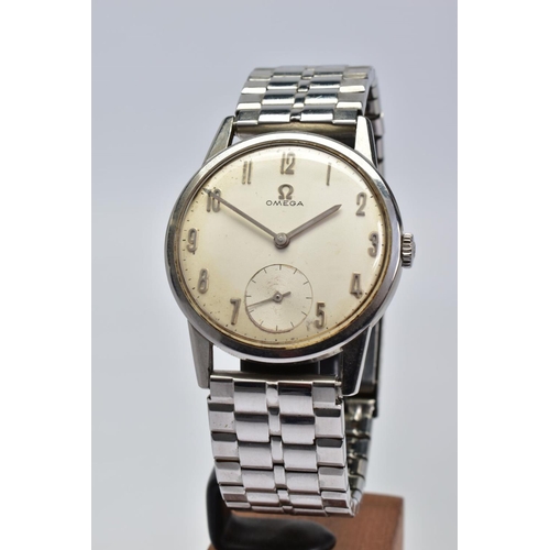 164 - A HAND WOUND STAINLESS STEEL OMEGA WRISTWATCH, silvered dial, degraded with age, Arabic numerals and... 