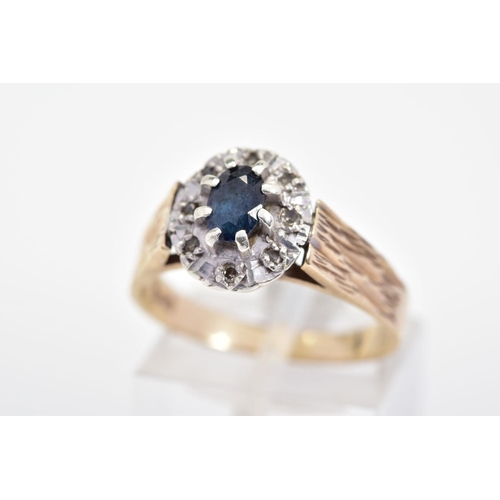 219 - A MODERN SAPPHIRE AND DIAMOND OVAL CLUSTER RING, ring size N1/2, hallmarked 9ct gold, London, approx... 