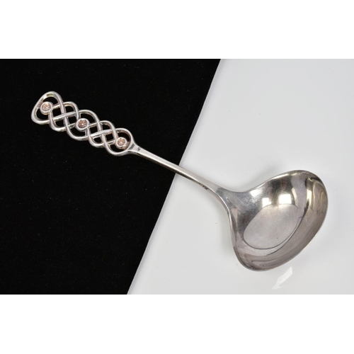 22 - A SCANDINIAVIAN DAVID ANDERSEN LADLE SPOON, the graduated terminal of interlocking knot design, with... 