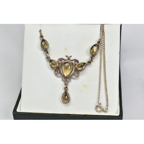 23 - A CITRINE NECKLACE, the front panel designed as a triangular scrolling panel collet set with pear sh... 