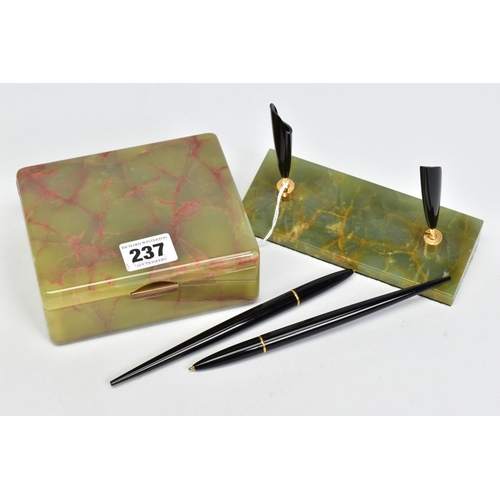 237 - A GREEN ONYX DESK SET, comprised pen holder which houses two black ball point pens which are mounted... 