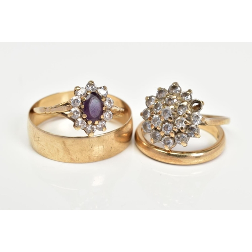 25 - FOUR 9CT GOLD RINGS, to include an amethyst and cubic zirconia oval cluster ring, ring size M, cubic... 