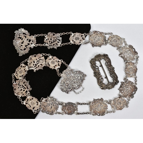 34 - TWO ITEMS, to include a late Victorian silver belt, comprised pierced floral and foliate scroll desi... 