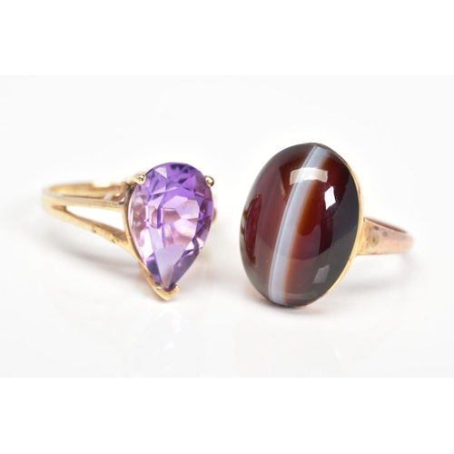 44 - TWO GEM SET RINGS, the first set with an oval agate cabochon, stamped 9ct, ring size O, the second a... 