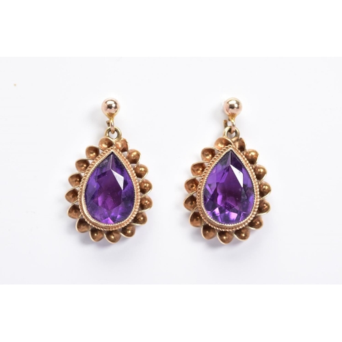 49 - A PAIR OF 9CT GOLD AMETHYST DROP EARRINGS, each designed as a pear shape amethyst within a double ro... 