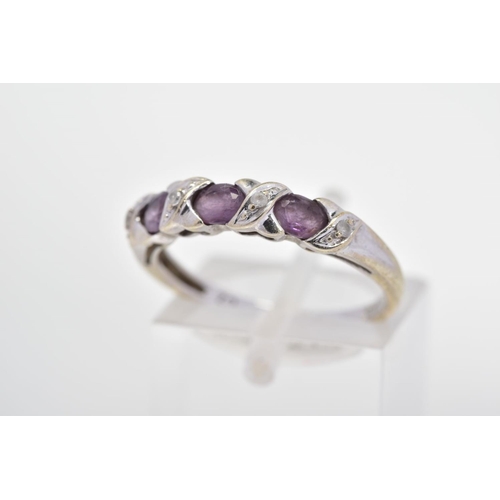 62 - A CUBIC ZIRCONIA DRESS RING, designed as three oval purple cubic zirconias, each interspaced by a ci... 