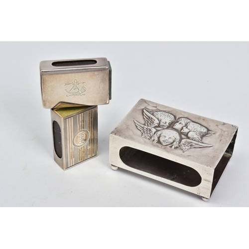 63 - THREE SILVER MATCH BOX COVERS, the largest repousse decorated with Reynolds Angels, on four ball fee... 