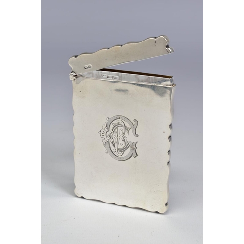 65 - AN EDWARDIAN SILVER CARD CASE OF WAVY RECTANGULAR FORM, engraved monogram to front, maker Willaim  N... 