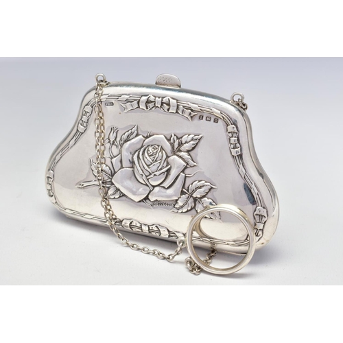 72 - A GEORGE V SILVER PURSE, repousse decorated with roses and ribbons to both sides, on a chain with fi... 