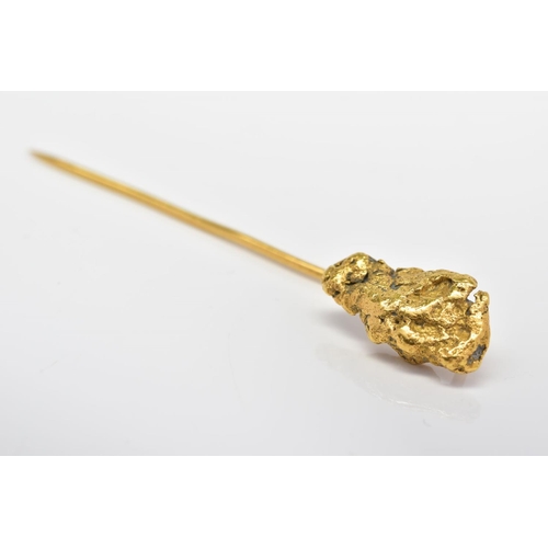 88 - A NUGGET STICKPIN, the terminal designed as a textured gold nugget to the plain pin, tests as 24ct, ... 