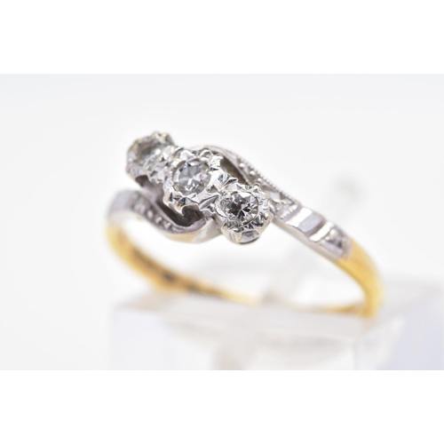 94 - A THREE STONE DIAMOND RING, designed as a diagonal line of graduated brilliant cut diamonds within i... 