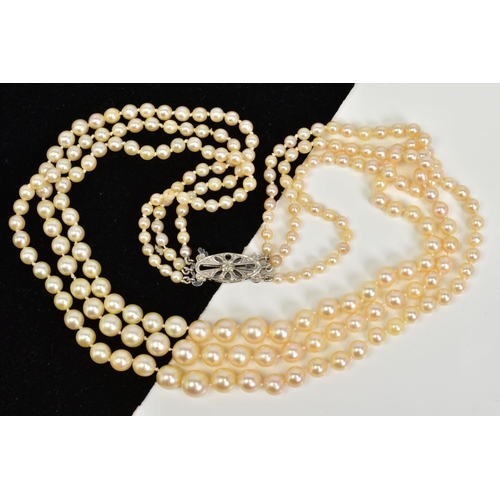 96 - A THREE ROW CULTURED PEARL NECKLACE WITH 9CT GOLD CLASP, designed as three graduated rows of spheric... 