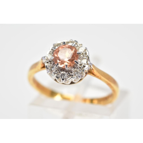 98 - AN 18CT GOLD TOPAZ AND DIAMOND CLUSTER RING, designed with a central circular cut orange/pink topaz ... 