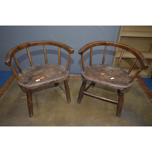 1686 - A PAIR OF 19TH CENTURY AND LATER OAK AND ELM CHILDS ARMCHAIRS with an arched spindled back