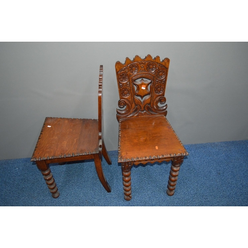 1689 - AN EARLY 20TH CENTURY CARVED OAK HALL TABLE decorated with foliate and roundel decoration, the table... 