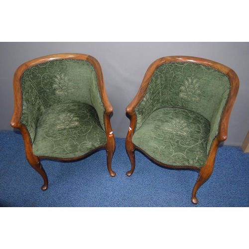 1690 - A PAIR OF LATE 19TH/EARLY 20TH CENTURY WALNUT ARMCHAIRS with swept arm rests covered with green upho... 