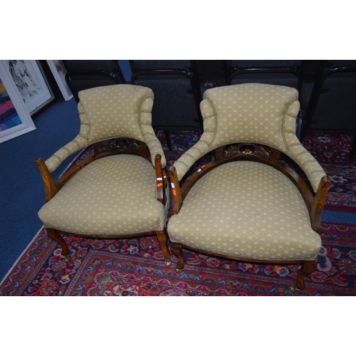 1693 - A PAIR OF EDWARDIAN MAHOGANY TUB CHAIRS, with lime green upholstery on brass casters