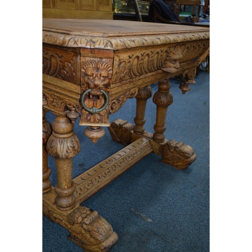 1696 - AN EARLY 20TH CENTURY OAK TABLE, canted corners above a lions mask to each corner, three lions with ... 