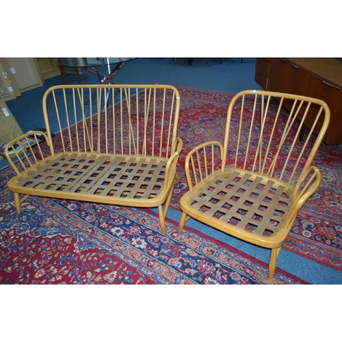 1683 - AN ERCOL JUBILEE BLONDE ELM TWO PIECE SUITE, comprising of a two seater settee and an armchair (no c... 