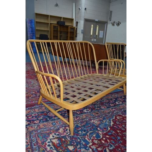 1683 - AN ERCOL JUBILEE BLONDE ELM TWO PIECE SUITE, comprising of a two seater settee and an armchair (no c... 