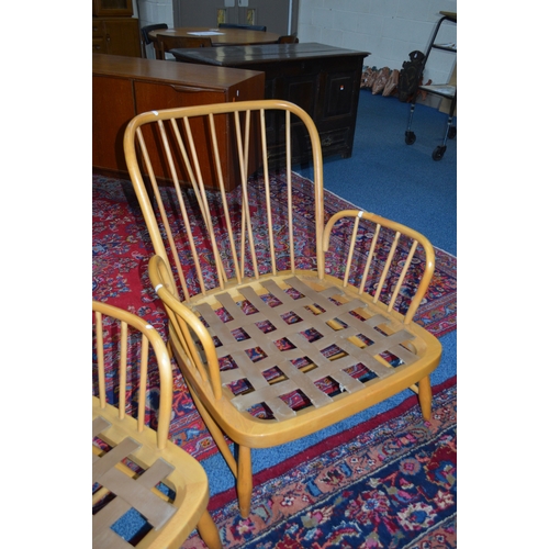 1683 - AN ERCOL JUBILEE BLONDE ELM TWO PIECE SUITE, comprising of a two seater settee and an armchair (no c... 