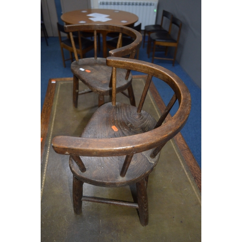 1686 - A PAIR OF 19TH CENTURY AND LATER OAK AND ELM CHILDS ARMCHAIRS with an arched spindled back