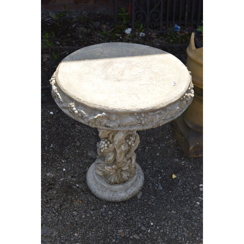 115 - A MODERN COMPOSITE CIRCULAR GARDEN TABLE, on a tree stump style base, diameter 60cm x height 73cm