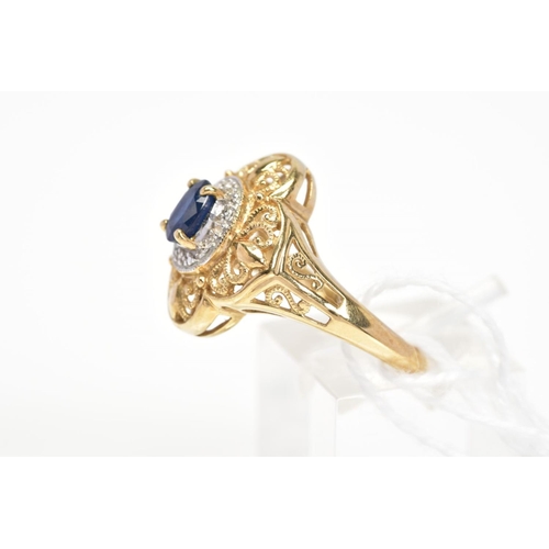 10 - A SAPPHIRE AND DIAMOND CLUSTER RING, the central oval cut sapphire within a surround set with four s... 