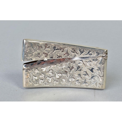 100 - AN EDWARDIAN SILVER CARD CASE OF BOWED RECTANGULAR FORM, hinged top, foliate engraved, circular belt... 