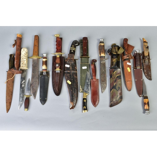 109 - A SMALL COLLECTION OF SEVENTEEN KNIVES AND DAGGERS, mainly hunting style, Eastern, Middle Eastern, E... 