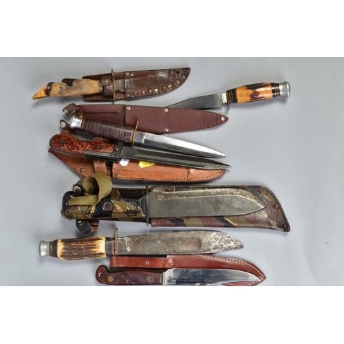 109 - A SMALL COLLECTION OF SEVENTEEN KNIVES AND DAGGERS, mainly hunting style, Eastern, Middle Eastern, E... 