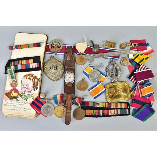 111 - A SMALL BOX OF MILITARIA, to include cap badges, two defence medals 1939-45, a military style wristw... 