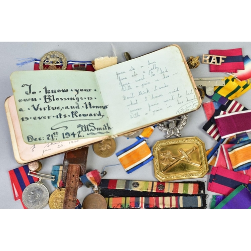 111 - A SMALL BOX OF MILITARIA, to include cap badges, two defence medals 1939-45, a military style wristw... 