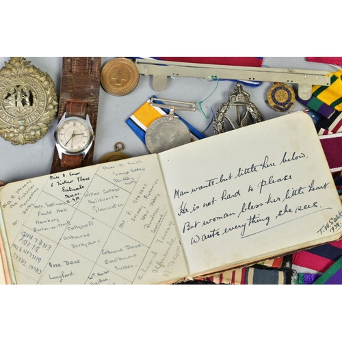 111 - A SMALL BOX OF MILITARIA, to include cap badges, two defence medals 1939-45, a military style wristw... 