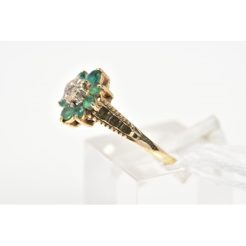 13 - A 9CT GOLD EMERALD AND DIAMOND CLUSTER RING, the central single cut diamond within a star illusion s... 