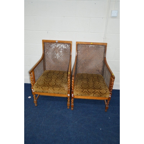 1380 - A PAIR OF OAK BERGERE ARMCHAIRS (sd to cane backs)