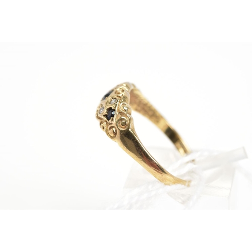 2 - A 9CT GOLD SAPPHIRE AND DIAMOND RING, designed as three graduated circular cut sapphires within a sc... 